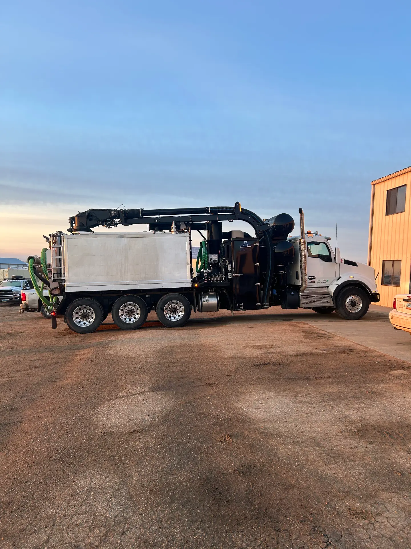 WOS hydrovac truck working at sunset in the Bakken