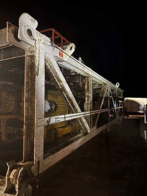 WOS power washer trailer staged at night under shop lights