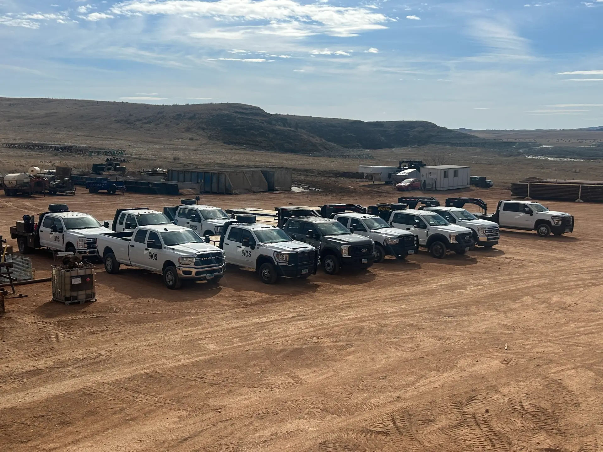 WOS service trucks lined up at the shop