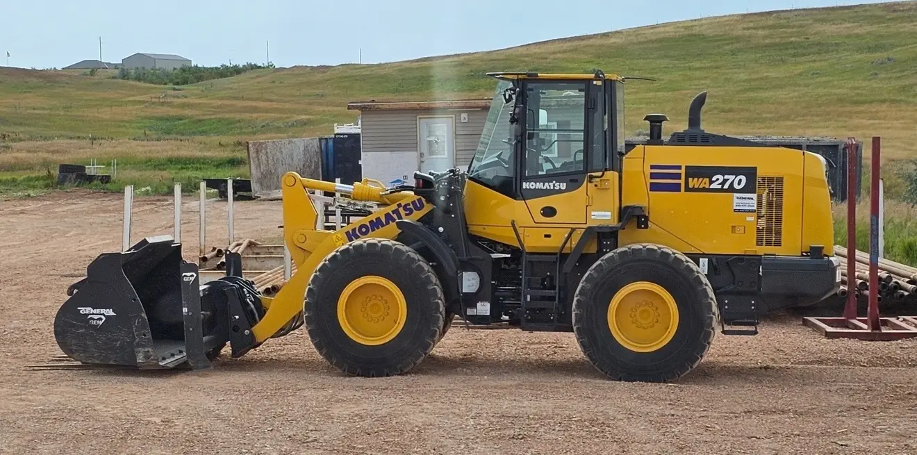 Komatsu WA270 wheel loader rental at a Bakken yard